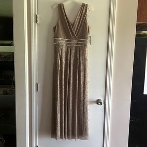 A brand new, never worn floor length dress with a little bling.